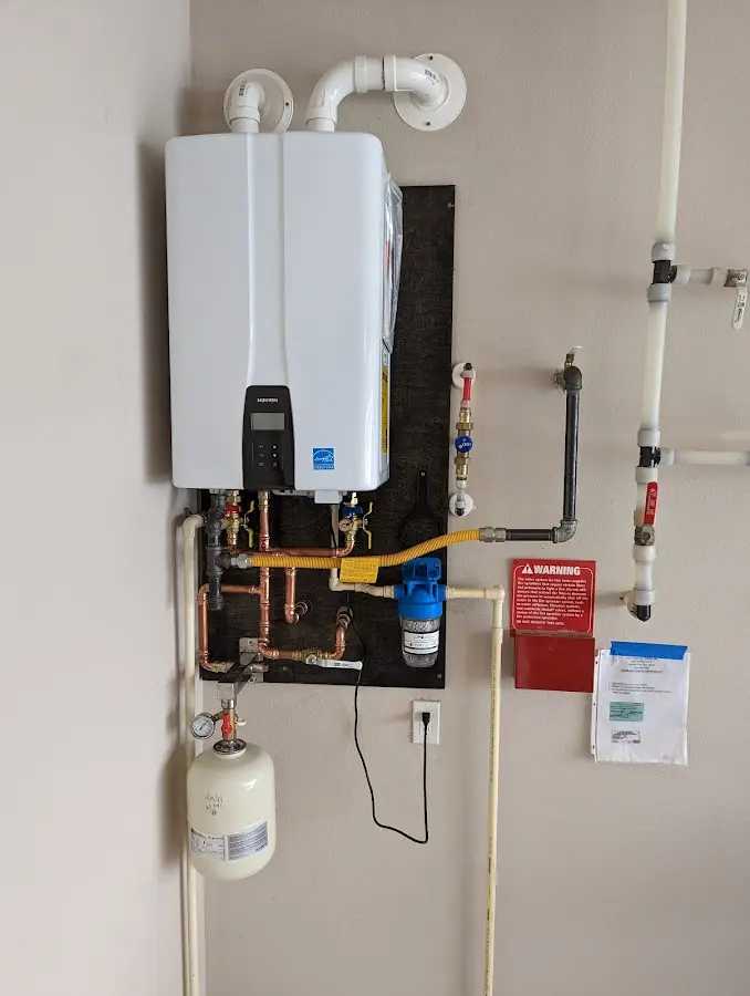 Professional plumber installing copper piping in a Aspen Hill home